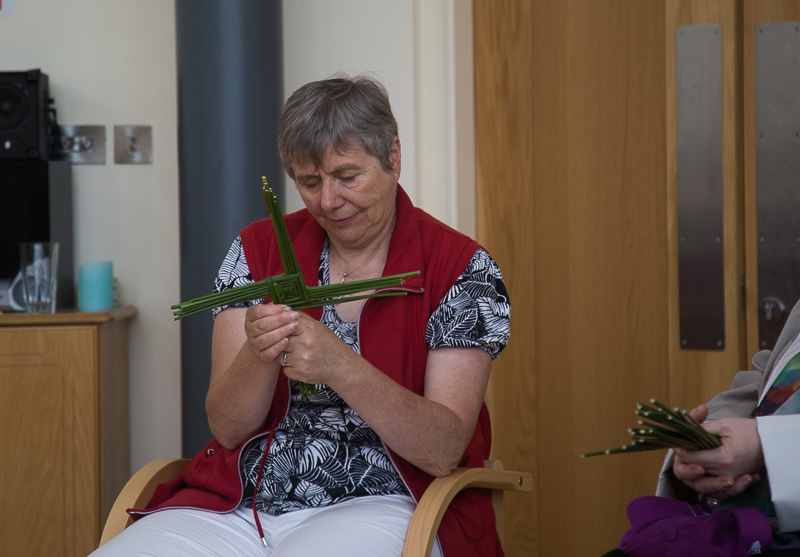 Sr. Phil weaves St. Brigid's cross at solas bhride