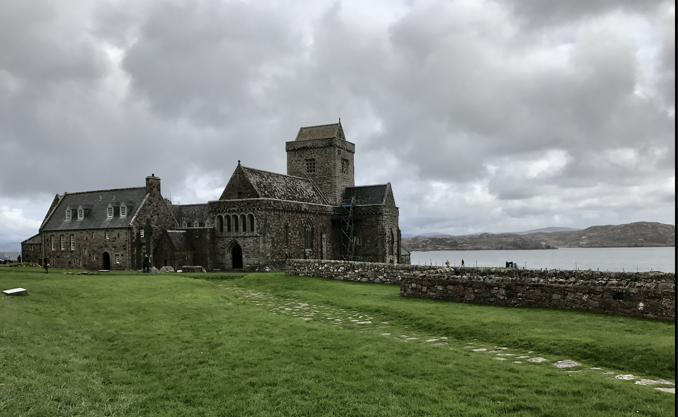 Street of the Dead - a grassy knoll with cobbles runs in front of Iona Abbey. 