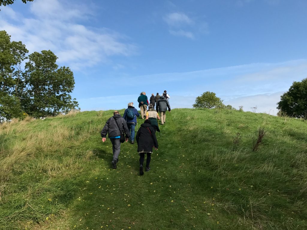 Guests walking up the great hill at Navan Fort - Co. Armagh