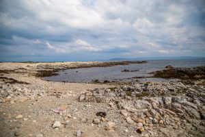 Storm Beach in Connemara - site of old graveyard now being eroded